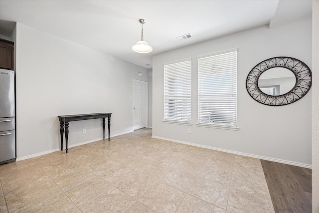 1721 Settlement Way, Aubrey, TX 76227 - unfurnished living room featuring baseboards, light tile patterned floors, and visible vents