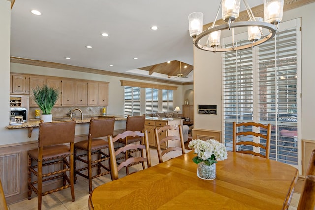 4580 Southgate Dr, Plano, TX 75024 - dining area with a chandelier, wainscoting, recessed lighting, a raised ceiling, and crown molding