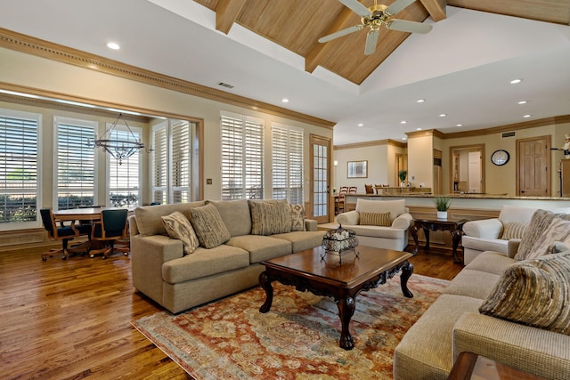 4580 Southgate Dr, Plano, TX 75024 - living area with a chandelier, wood finished floors, beam ceiling, ornamental molding, and recessed lighting
