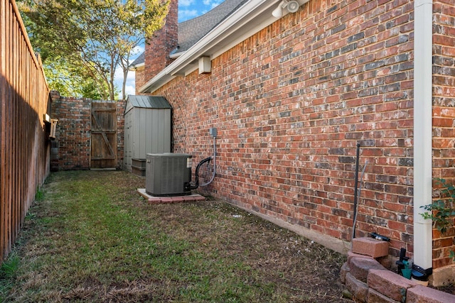 4580 Southgate Dr, Plano, TX 75024 - view of property exterior featuring brick siding, central air condition unit, and a chimney