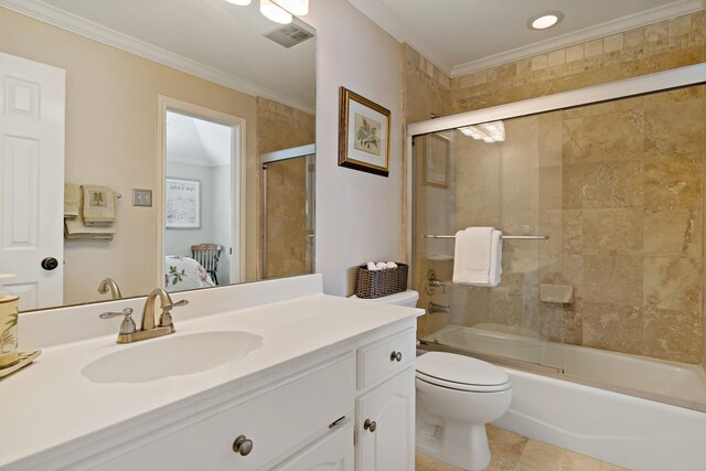 4580 Southgate Dr, Plano, TX 75024 - bathroom with crown molding, vanity, toilet, shower / bath combination with glass door, and tile patterned floors