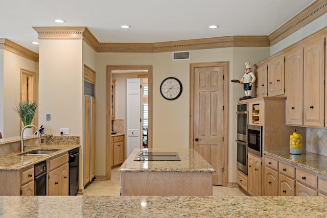 4580 Southgate Dr, Plano, TX 75024 - kitchen with a sink, stovetop with downdraft, light brown cabinetry, light stone countertops, and a center island