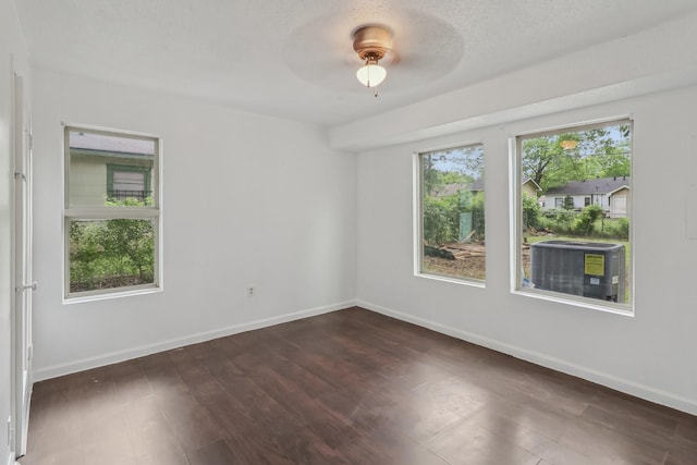 322 W Mcvey Ave, Dallas, TX 75224 - unfurnished room featuring baseboards, ceiling fan, and dark wood-type flooring