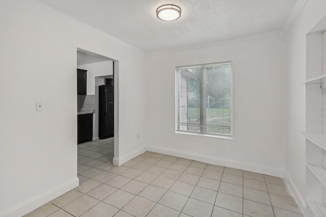 322 W Mcvey Ave, Dallas, TX 75224 - unfurnished room featuring crown molding, baseboards, a textured ceiling, and light tile patterned floors
