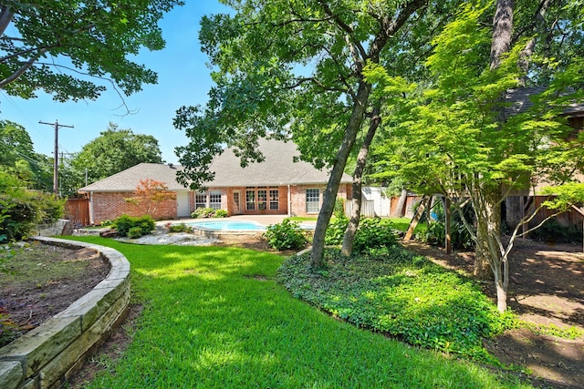 2411 Oak Shadow Ct, Arlington, TX 76017 - back of property with brick siding and roof with shingles
