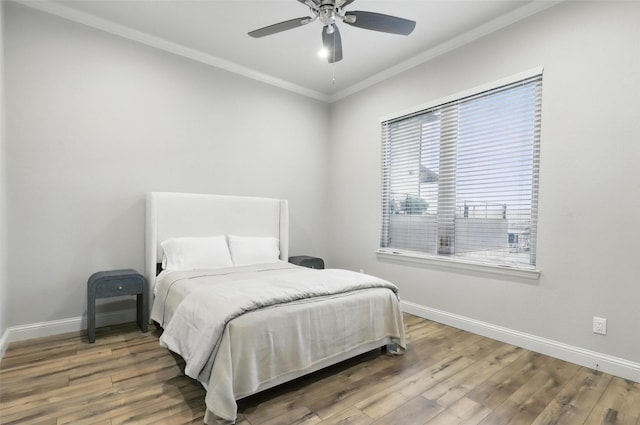 1011 Cardinal Cv, Graford, TX 76449 - bedroom with baseboards, ornamental molding, wood finished floors, and ceiling fan