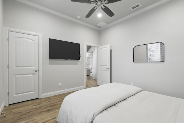 1011 Cardinal Cv, Graford, TX 76449 - bedroom with wood finished floors, ornamental molding, baseboards, and ceiling fan