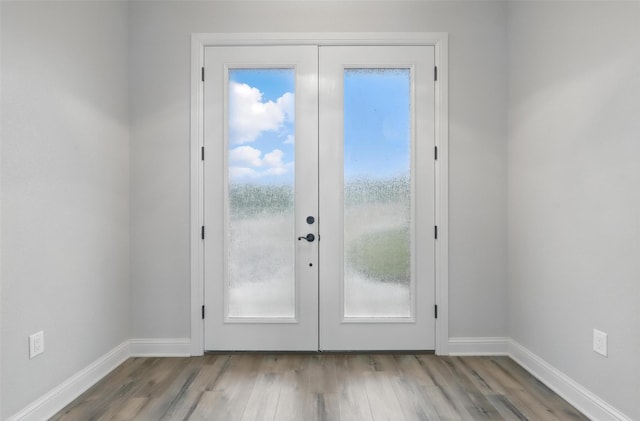 1011 Cardinal Cv, Graford, TX 76449 - doorway to outside featuring wood finished floors, baseboards, and french doors