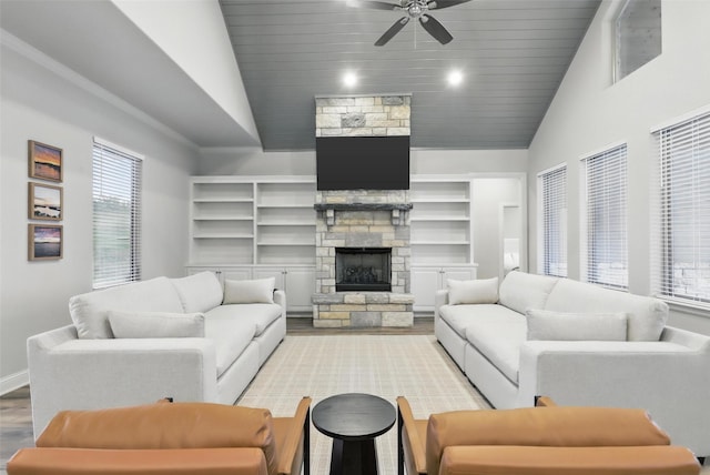 1011 Cardinal Cv, Graford, TX 76449 - living area with lofted ceiling, wood finished floors, wood ceiling, a ceiling fan, and a fireplace