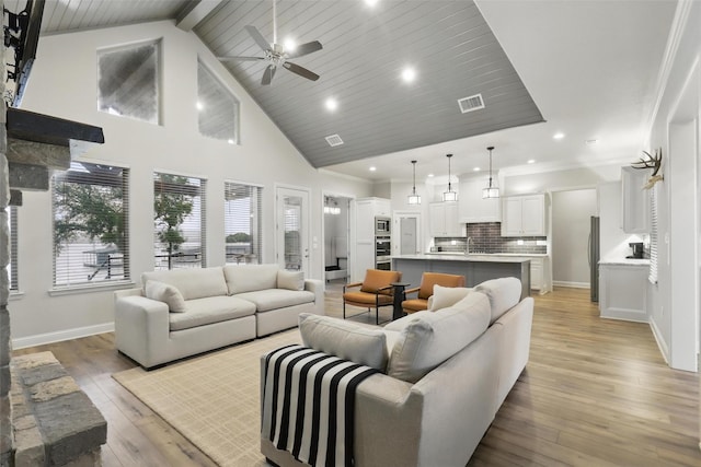 1011 Cardinal Cv, Graford, TX 76449 - living room with ceiling fan, baseboards, light wood-type flooring, recessed lighting, and high vaulted ceiling