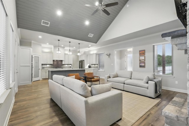 1011 Cardinal Cv, Graford, TX 76449 - living room with baseboards, ceiling fan, recessed lighting, wood finished floors, and high vaulted ceiling