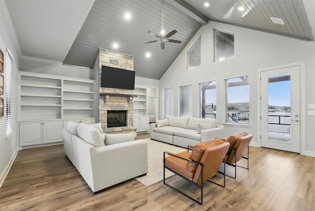 1011 Cardinal Cv, Graford, TX 76449 - living area featuring a fireplace, high vaulted ceiling, baseboards, wood finished floors, and a ceiling fan