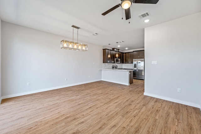 unfurnished living room featuring a ceiling fan, baseboards, visible vents, light wood-style floors, and recessed lighting