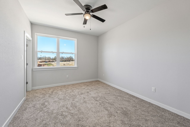 unfurnished room with baseboards, carpet flooring, and ceiling fan