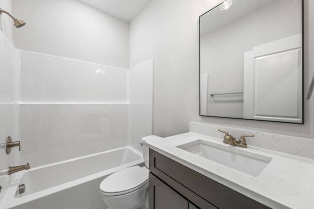 full bathroom featuring tub / shower combination, toilet, and vanity