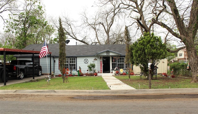 1090 N Race St, Stephenville, TX 76401 - view of front of home featuring a front yard, a carport, and roof with shingles