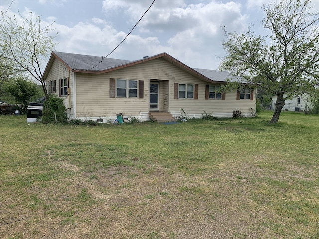 ranch-style house with entry steps and a front yard