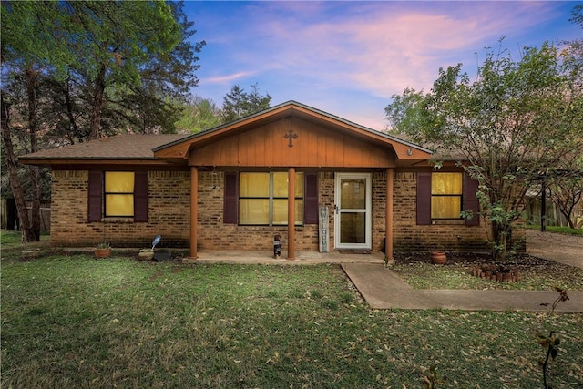 509 E Karels Dr, Waco, TX 76706 - view of front of home with a porch, brick siding, and a front yard