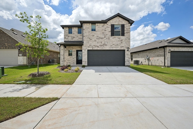 3914 Walmer Way, Princeton, TX 75071 - view of front of home with driveway, a front lawn, central AC, and an attached garage