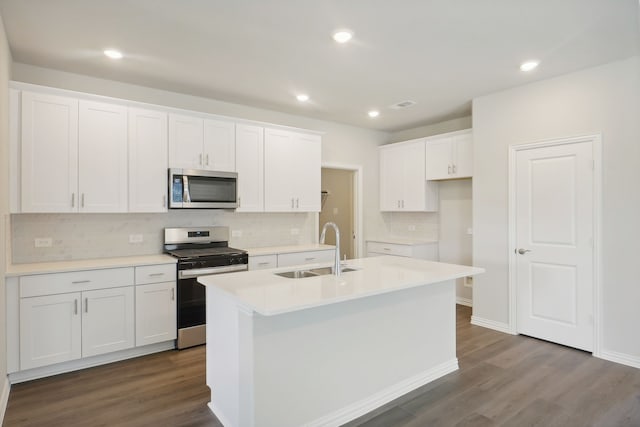 3914 Walmer Way, Princeton, TX 75071 - kitchen featuring stainless steel appliances, a sink, white cabinets, decorative backsplash, and an island with sink