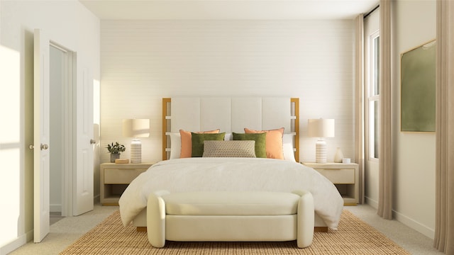 bedroom featuring light carpet and baseboards