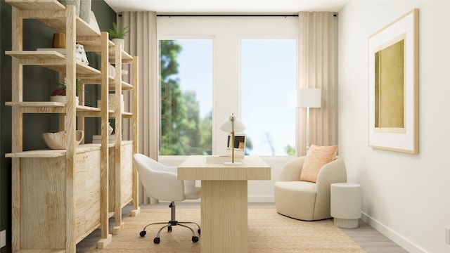 office featuring baseboards and wood finished floors