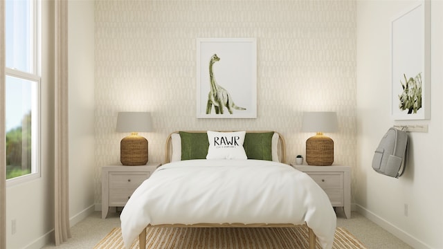 bedroom featuring baseboards, wallpapered walls, and multiple windows