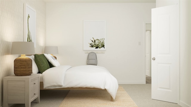 bedroom with baseboards and carpet floors