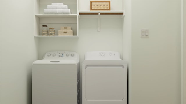 laundry room featuring washing machine and dryer and laundry area
