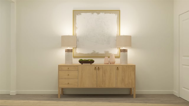 bedroom with baseboards and light wood finished floors