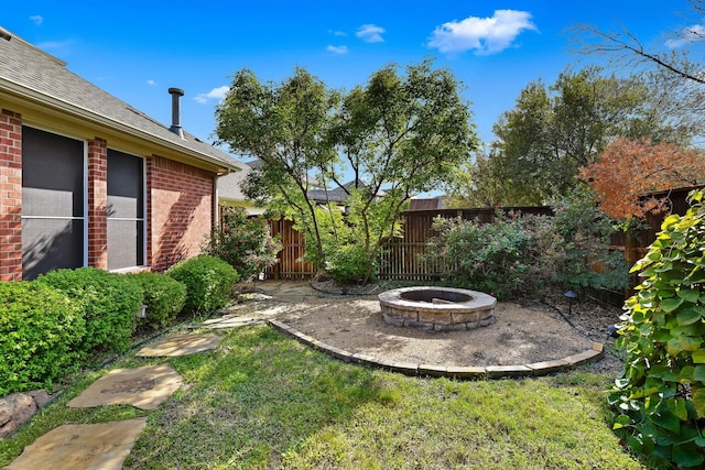 1431 Bonham Pkwy, Lantana, TX 76226 - fenced backyard featuring an outdoor fire pit and a patio