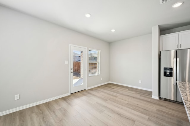 709 Caraway Dr, Princeton, TX 75071 - empty room featuring light wood finished floors, baseboards, and recessed lighting
