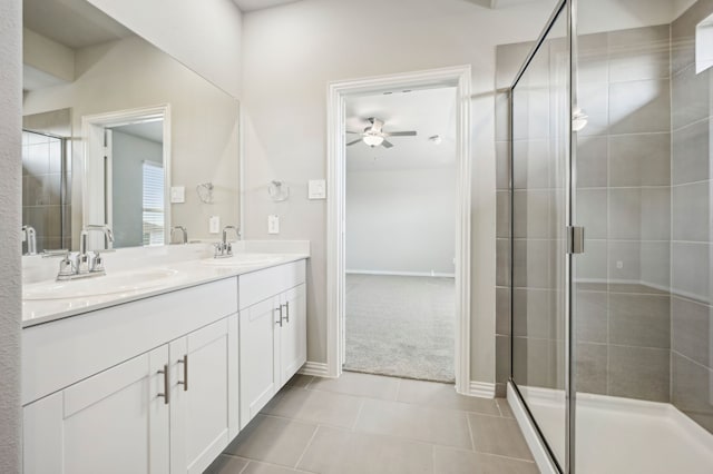 709 Caraway Dr, Princeton, TX 75071 - bathroom featuring a ceiling fan, a shower stall, tile patterned flooring, double vanity, and baseboards