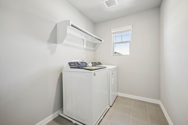709 Caraway Dr, Princeton, TX 75071 - laundry area with independent washer and dryer, baseboards, and light tile patterned floors