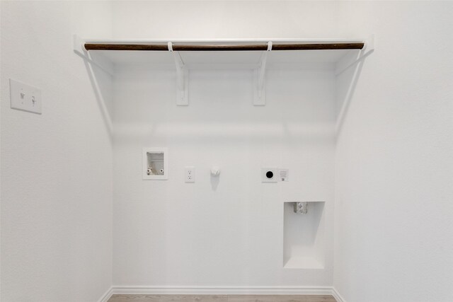 washroom with washer hookup, baseboards, electric dryer hookup, laundry area, and hookup for a gas dryer