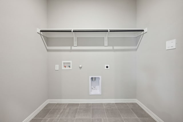 washroom featuring hookup for an electric dryer, hookup for a gas dryer, baseboards, laundry area, and washer hookup