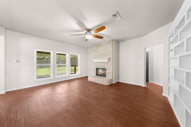 1403 Derby Dr, Kennedale, TX 76060 - unfurnished living room featuring a ceiling fan, a brick fireplace, and wood finished floors