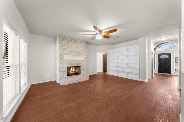1403 Derby Dr, Kennedale, TX 76060 - unfurnished living room featuring a ceiling fan and a fireplace
