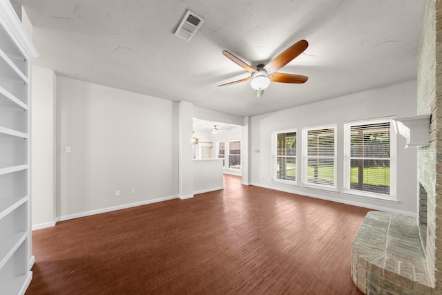 1403 Derby Dr, Kennedale, TX 76060 - unfurnished living room featuring a ceiling fan, wood finished floors, and a brick fireplace