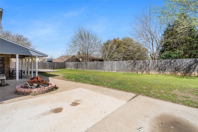 view of patio / terrace with an outdoor fire pit and fence