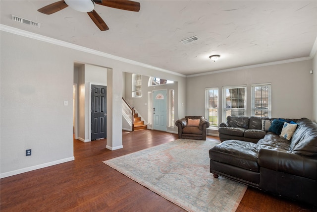 living room with baseboards, dark wood-style floors, stairway, and visible vents
