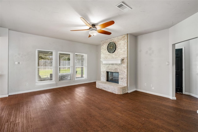 unfurnished living room with wood finished floors, baseboards, ceiling fan, and visible vents