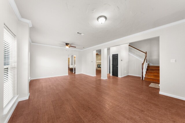 1403 Derby Dr, Kennedale, TX 76060 - unfurnished living room featuring a ceiling fan, stairway, wood finished floors, a fireplace, and crown molding