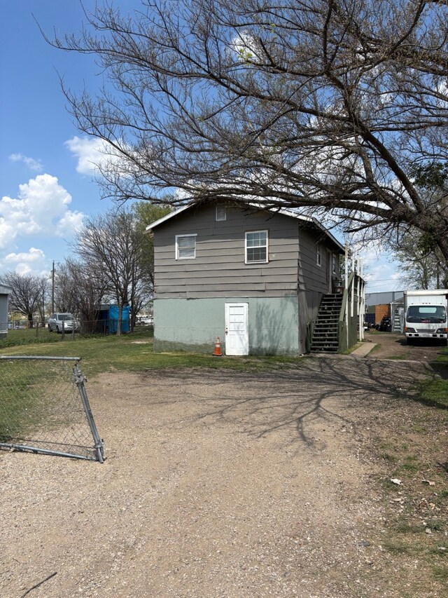 8947 Adams Cir, Cresson, TX 76035 - view of side of home featuring stairs