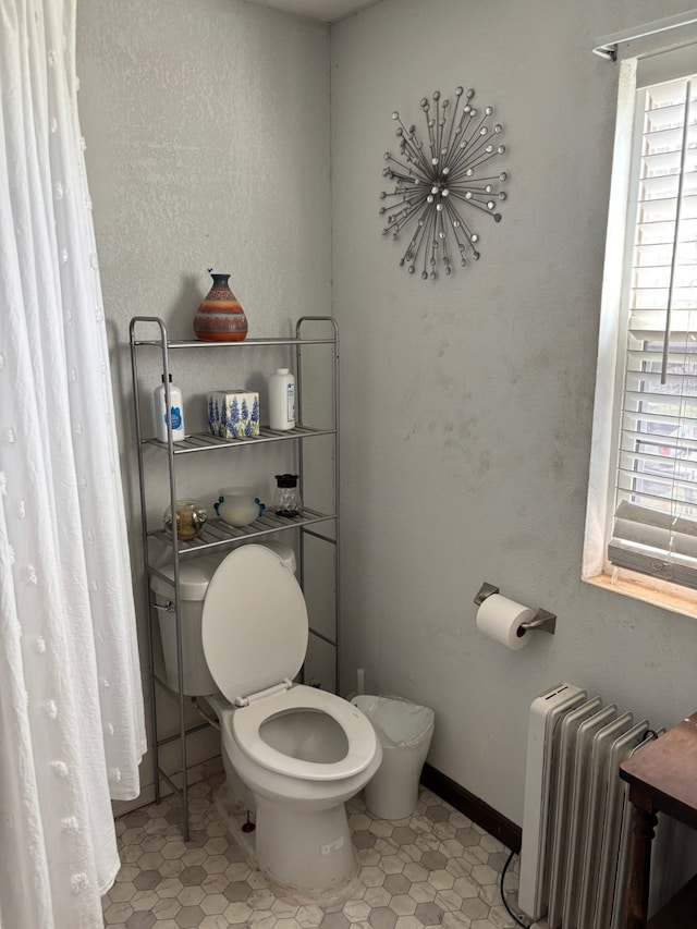8947 Adams Cir, Cresson, TX 76035 - bathroom featuring tile patterned floors, toilet, baseboards, and radiator heating unit