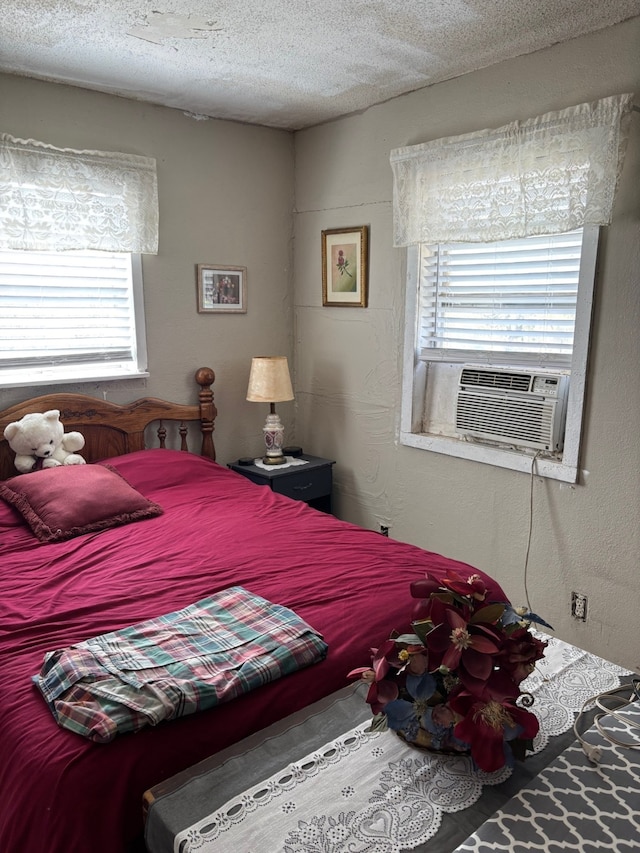 8947 Adams Cir, Cresson, TX 76035 - bedroom featuring multiple windows, cooling unit, and a textured ceiling