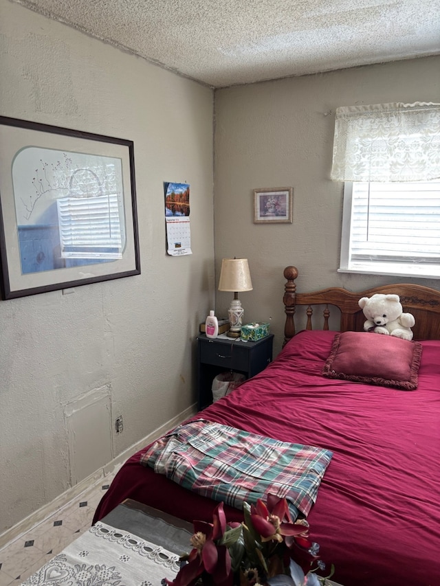 8947 Adams Cir, Cresson, TX 76035 - bedroom with a textured ceiling, baseboards, and a textured wall