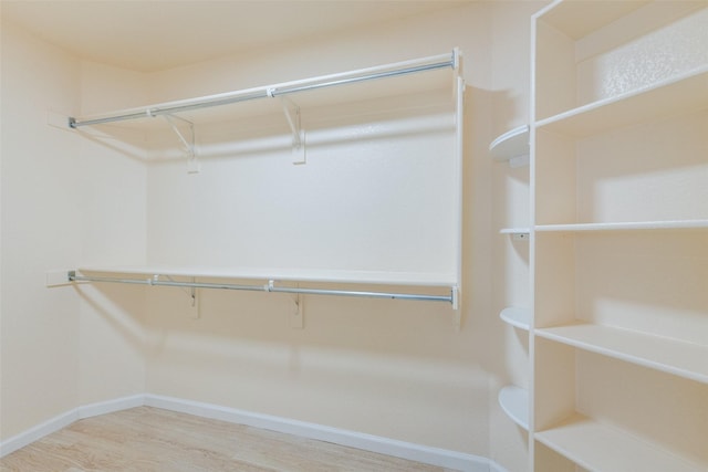 8729 Shavano Dr, Fort Worth, TX 76123 - walk in closet with wood finished floors