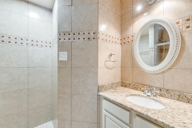 8729 Shavano Dr, Fort Worth, TX 76123 - full bath with vanity, tiled shower, and tile walls