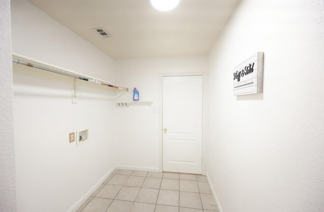 8729 Shavano Dr, Fort Worth, TX 76123 - laundry area featuring hookup for a washing machine, baseboards, and light tile patterned floors